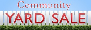Yard Sale sign on white fence and blue sky.